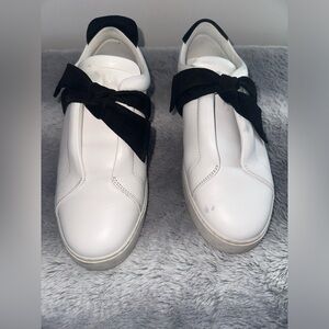 Chic White Sneakers with Black Bow Accent